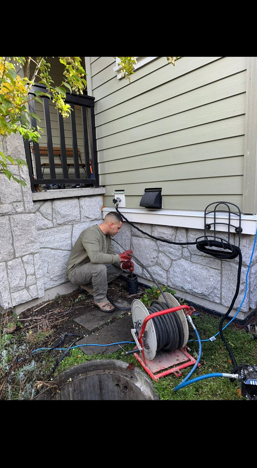 Hydro-jet drain cleaning at a residential sewer cleanout in Vancouver