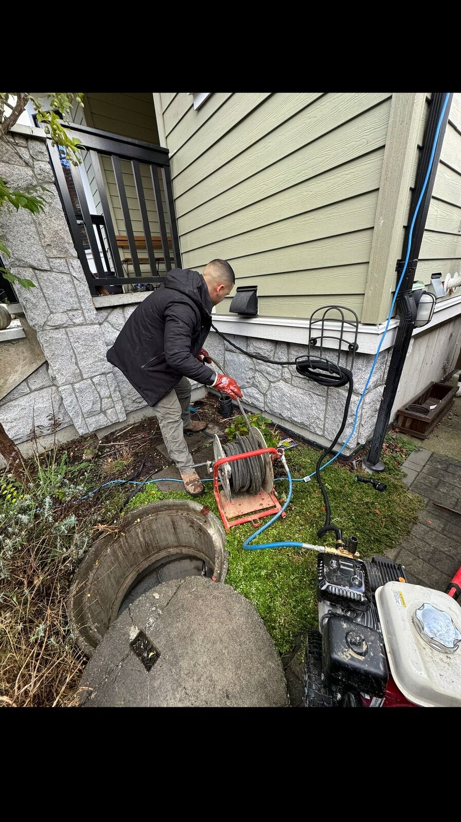HYDROPRO plumber operating sewer line hydro-jetter at a Burnaby property